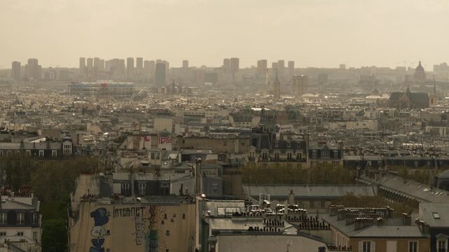 Panoramic View of Paris Skyline and Dense Urban Rooftops from Montmartre, France