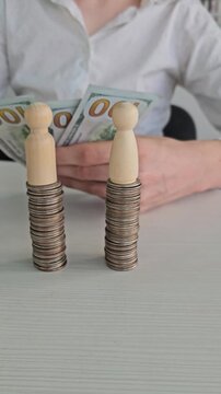 Stacking coins with figures while counting cash