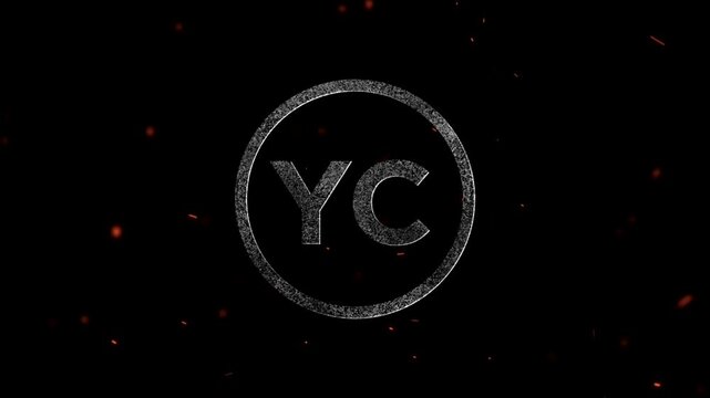 Letters YC inside a circular frame with particle effects