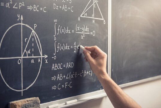 Mathematics lesson with chalkboard and formulas in classroom
