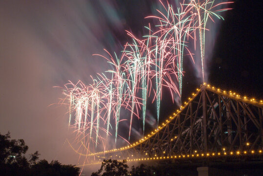 View of fireworks exploding over the Story Bridge at night in Brisbane, Queensland, Australia.