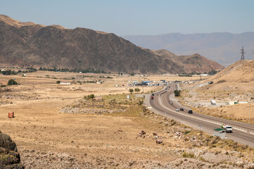 Highway through the mountain landscape of Boom Gorge in Kyrgyzstan. © Natalia