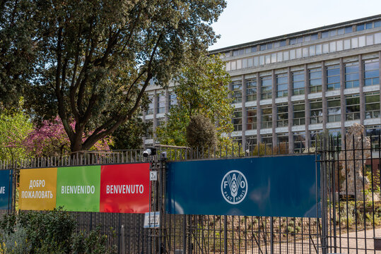 Rome, Italy - April 09, 2026 - Gate and Logo with FAO Headquarters Building in the Background, Rome
