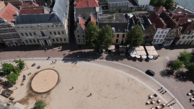 Overhead view of paved town square near Lebuinuskerk with visitors