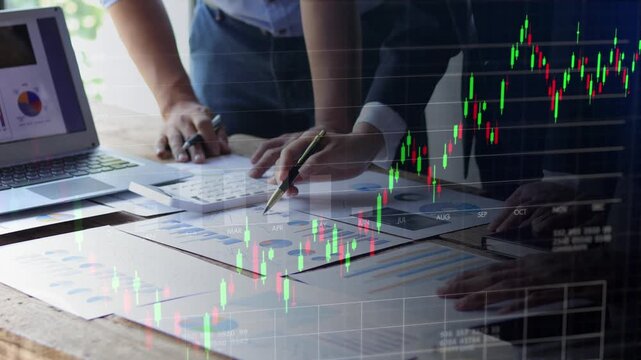 Double exposure footage of business team analyzing documents with candlestick stock chart and grid overlay, financial trading concept