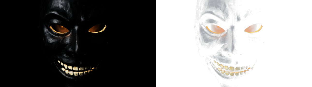 Spooky black evil monster mask with glowing eyes and creepy grin for Halloween designs, PNG , isolated on transparent background