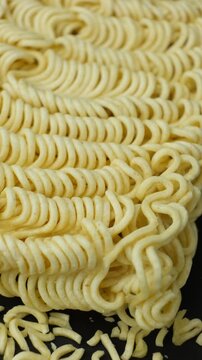 Macro pattern of dry yellow wavy instant noodles