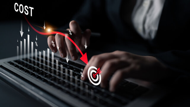 Businessman Analyzing Financial Data on Laptop with Graphs Indicating Decrease in Cost and Targeting Success in Investment Strategy. Glyphic.