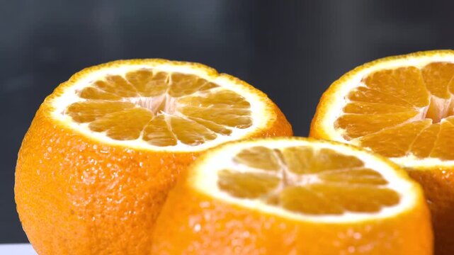 Fresh Orange Halves on Dark Background