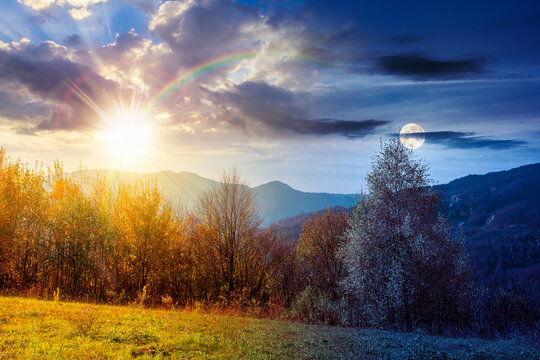 beautiful autumn in Carpathian mountains. day meet night. sun and moon over trees on the edge of a hill in fall colors at twilight. wonderful countryside landscape for astrology wallpaper