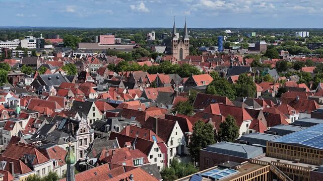 Elevated panoramic view sweeping across Deventer rooftops and historic center