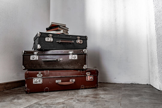 background of old vintage suitcases stacked