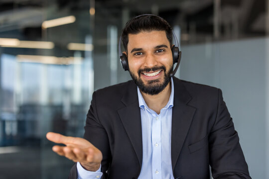 Smiling man wearing headset providing customer service and support