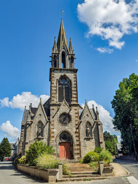 Dol de Bretagne, France, Europe - August 6, 2026: Front entrance with the tower of the Church of Notre-Dame de l'Assomption on the street, named Rue de la Font Saint-Samson, on the SE side of downtown