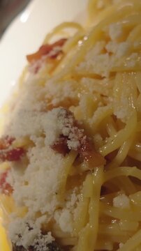 Delicious italian spaghetti carbonara with fresh pepper