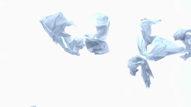 Crumpled white paper sheets falling slowly