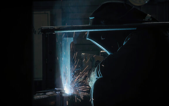 Welder at Work in Industrial Setting