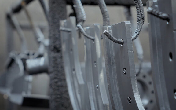 Close-up of Welded Metal Plate with Bolts and Threaded Rod