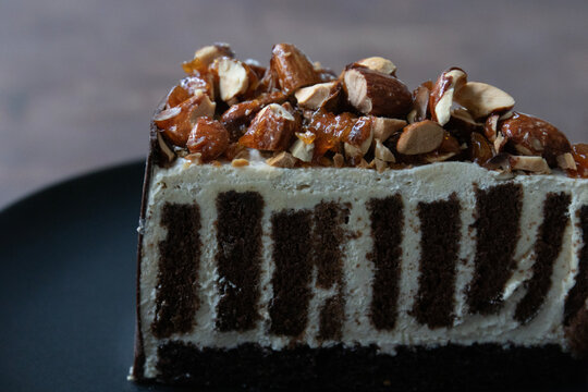 Praline Chocolate Cake, Slice of Creamy Caramel Almond Tart topped with Crunchy Roasted Almonds
