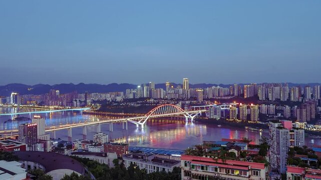 Illuminated Arch Bridge Over River in Chongqing China at Night