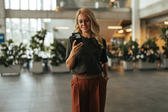 Professional woman using smartphone for business communication