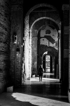 Young Woman Walking Through the Ancient Hallway of the Tabularium in Rome