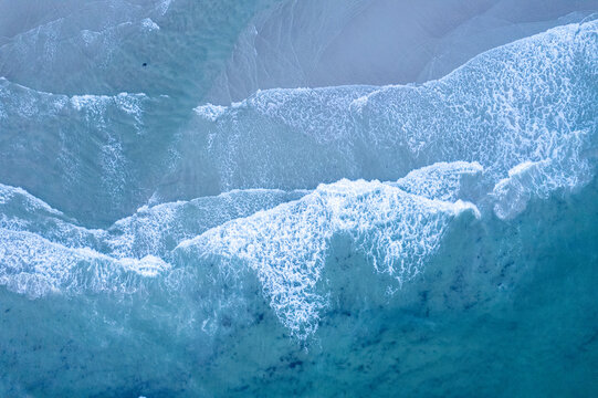 Deep blue sea water washing over coastal rocks The Concept of wild nature
