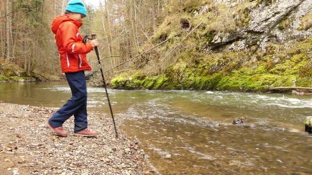 Little beautiful girl walks in Slovak Paradise. Slovak Paradise (Slovensky raj) is mountain range in eastern Slovakia, part of Spis-Gemer Karst, located between towns of Spisska Nova Ves and Dobsina.