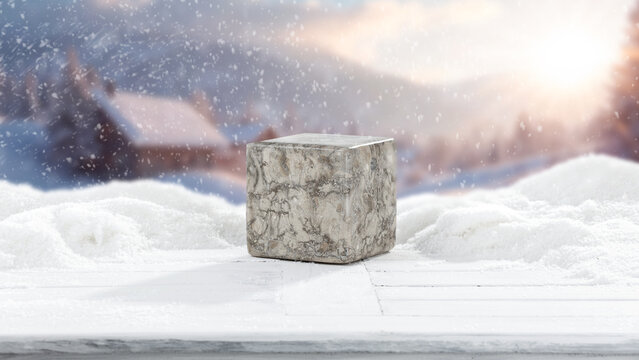 Winter mockup composition with clean space for product placement surrounded by fresh snow. Blurred snowy mountain landscape in the background. Clear copy space for product, logo, text or advertising.