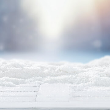 Winter product mockup with copy space &ndash; snowy mountain landscape and product placement. Clean space for product placement surrounded by fresh snow. Winter template for commercial campaigns.