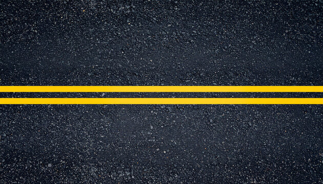 Fresh black asphalt road texture background with bright yellow double no-passing lines. Creating modern transportation background.