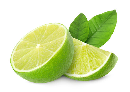 Pieces of limes and green leaves isolated on white. Citrus fruit