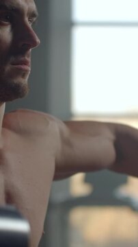 Close-up cinematic portrait transition of a muscular male torso and focused face, highlighting defined chest, shoulders, and contemplative expression in soft natural light