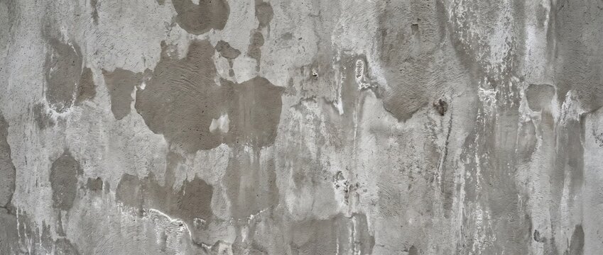 Water stained concrete wall texture background. Weathered grey cement surface with damp marks