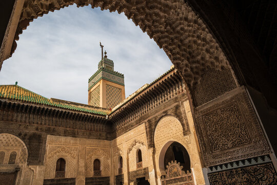 Al-Attarine Madrasa Courtyard View Through Carved Arch in Fes Morocco 