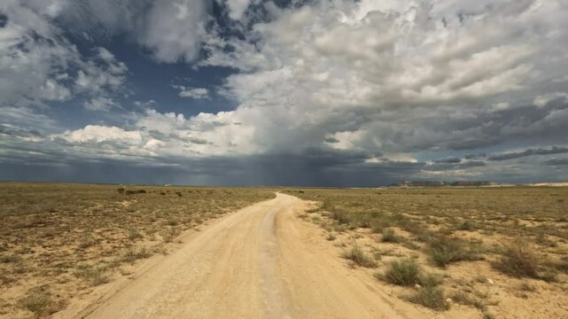 Forward movement on a dirt road through an open landscape