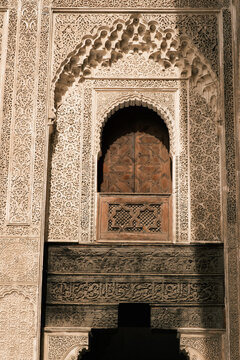 ecorations inside the historic Al-Attarine Madrasa courtyard in Fes, Morocco
