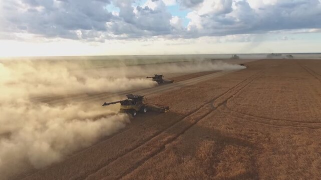 Desert Battlefield Scene: Two Wheeled Missile Launchers Advance Across Dusty Arid Plain Under Expansive Sunset Sky With Dramatic Clouds, Smoke Trails, Warm Golden Light