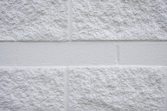 White cinder block wall texture with rough surface