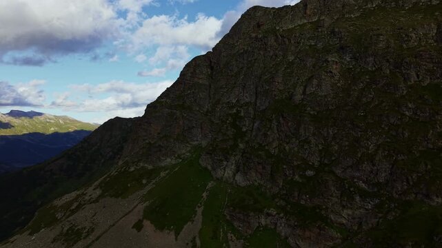 Aerial panning shot of rocky mountain slope