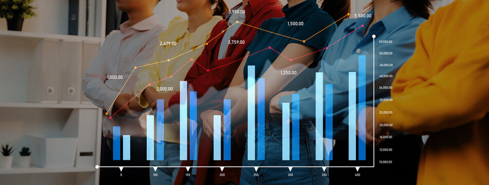 A diverse group of professionals stands together in an office, analyzing crucial financial data represented through bar graphs and line charts, symbolizing teamwork and strategy. Scalp