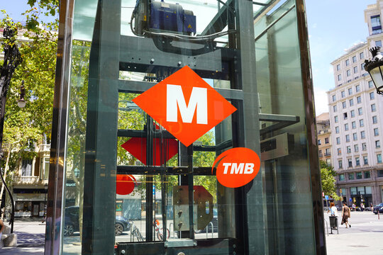 BARCELONA, SPAIN - AUGUST 23, 2026: Entrance of Barcelona metro station with TMB logo on a sunny day in urban city