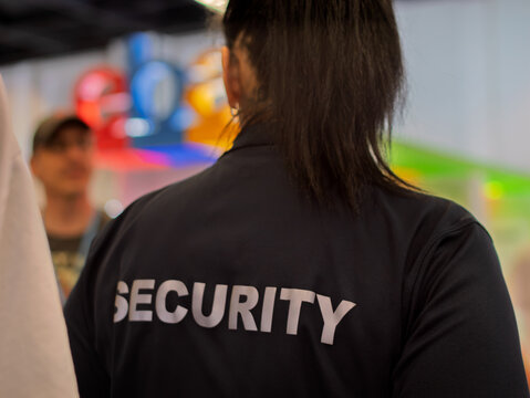 Security Personnel Monitoring Crowd at Event