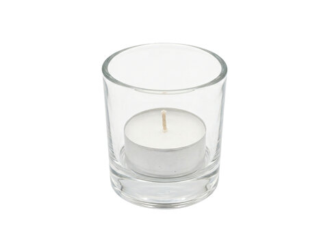 A clear glass votive candle holder containing a white tealight with a fabric wick, viewed from an elevated angle, showcasing transparent polished glass and aluminum casing, isolated on transparent