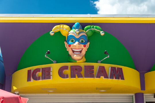 A colorful jester face decorates an ice cream sign at Daytona Beach.
