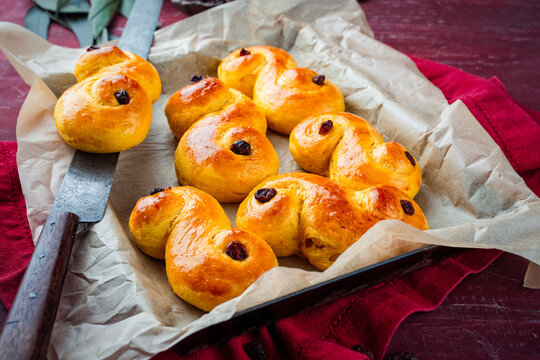Classic artisan homemade  traditional Swedish  St Lucia buns lussekatter served as close-up on backing paper