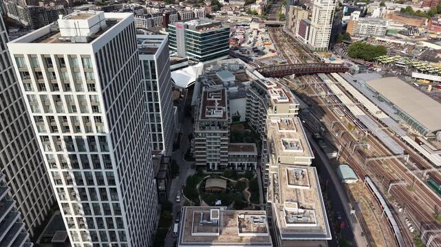 Aerial view of Londons Stratford rail hub and Westfield mall, serving commuters and shoppers in this major urban development zone.