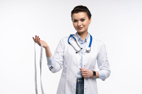 Portrait of pretty positive lady doctor with empty space blank isolated on white background.