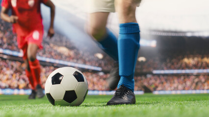 Football player ready for free kick and shot to score goal for blue team, striker with technique focusing on kicking ball forward and hit net. © DC Studio