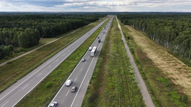 Highway traffic with trucks and cars on Polish motorway